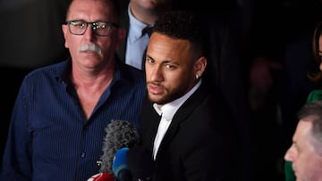 Brazilian football player Neymar (C) speaks to media members as he leaves on crutches from the Women's Defence Precinct in Sao Paulo, Brazil, on June 13, 2019, after testifying due to Brazilian Najila Trindade filed a complaint against him on May 31,
