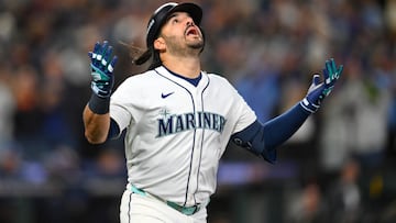 Oct 17, 2025; Seattle, Washington, USA; Seattle Mariners third baseman Eugenio Suarez (28) reacts after hitting a grand slam against the Toronto Blue Jays during the eighth inning during game five of the ALCS round for the 2025 MLB playoffs at T-Mobile Park. Mandatory Credit: Steven Bisig-Imagn Images