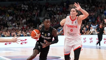 Germany's Dennis Schroder in action with Turkey's Cedi Osman.