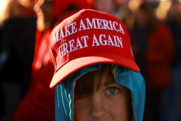 A boy wears a MAGA hat, on the day Republican presidential nominee and former U.S. President Donald Trump attends a campaign rally in Albuquerque, New Mexico, U.S. October 31, 2024. REUTERS/Jose Luis Gonzalez TPX IMAGES OF THE DAY