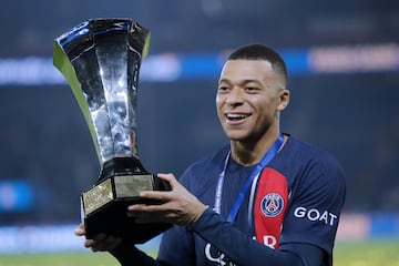Paris Saint Germain's Kylian Mbappe celebrates with the trophy after winning the Trophee Des Champions (French Super Cup) against Toulouse.
