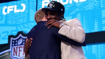 GREEN BAY, WISCONSIN - APRIL 24: Quarterback Cam Ward of Miami celebrates with NFL Commissioner Roger Goodell after being selected first overall pick by the Tennessee Titans during the first round of the 2025 NFL Draft at Lambeau Field on April 24, 2025 in Green Bay, Wisconsin. Stacy Revere/Getty Images/AFP (Photo by Stacy Revere / GETTY IMAGES NORTH AMERICA / Getty Images via AFP)