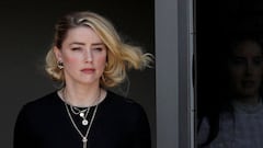 FILE PHOTO: Amber Heard leaves Fairfax County Circuit Courthouse after the jury announced split verdicts  in the Depp v. Heard civil defamation trial at the Fairfax County Circuit Courthouse in Fairfax, Virginia, U.S., June 1, 2022. REUTERS/Tom Brenner/File Photo