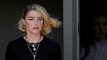 Amber Heard leaves Fairfax County Circuit Courthouse after the jury announced split verdicts.