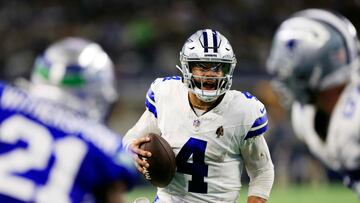 ARLINGTON, TEXAS - NOVEMBER 30: Quarterback Dak Prescott #4 of the Dallas Cowboys scrambles during the 2nd quarter of the game against the Seattle Seahawks at AT&T Stadium on November 30, 2023 in Arlington, Texas. Ron Jenkins/Getty Images/AFP (Photo by Ron Jenkins / GETTY IMAGES NORTH AMERICA / Getty Images via AFP)