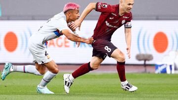 Soccer Football - Friendly - Vissel Kobe v FC Barcelona - Japan National Stadium, Tokyo, Japan - June 6, 2023 Vissel Kobe's Andres Iniesta in action with FC Barcelona's Julian Araujo REUTERS/Kim Kyung-Hoon