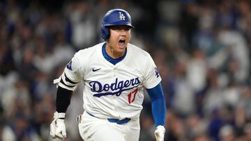 Sep 25, 2024; Los Angeles, California, USA; Los Angeles Dodgers designated hitter Shohei Ohtani (17) celebrates after hitting a single in the sixth inning against the San Diego Padres at Dodger Stadium. Mandatory Credit: Kirby Lee-Imagn Images