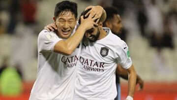 Sadd&#039;s midfielder Hassan al-Haidos (R) celebrates his goal with teammate Nam Tae-hee during the 2019 FIFA Club World Cup football match between Qatar&#039;s Al-Sadd and New Caledonia&#039;s Hienghene Sport at the Jassim Bin Hamad Stadium in the Qatar