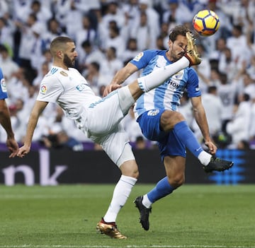 Karim Benzema attempts to bring the ball under control.
