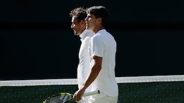 Tennis - Wimbledon - All England Lawn Tennis and Croquet Club, London, Britain - June 30, 2025 Spain's Carlos Alcaraz and Italy's Fabio Fognini after their first round match REUTERS/Stephanie Lecocq