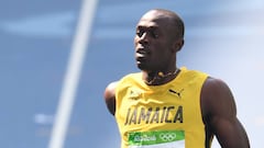 Bolt safely through 200m heats