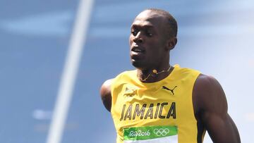 Bolt safely through 200m heats