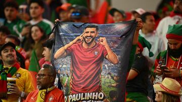 Portuguese fans show a sign depicting Portugal's forward #17 Paulinho during a friendly football match between Mexico and Portugal at the Banorte (formerly known as Azteca) Stadium in Mexico City on March 28, 2026. (Photo by CARL DE SOUZA / AFP)