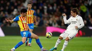 Soccer Football - LaLiga - Real Madrid v Valencia - Santiago Bernabeu, Madrid, Spain - February 2, 2023 Valencia's Andre Almeida in action with Real Madrid's Luka Modric REUTERS/Juan Medina