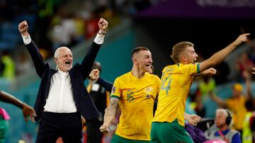 Soccer Football - FIFA World Cup Qatar 2022 - Group D - Australia v Denmark - Al Janoub Stadium, Al Wakrah, Qatar - November 30, 2022 Australia coach Graham Arnold celebrates with Australia's Riley McGree and Australia's Mitchell Duke after qualifying for the knockout stages REUTERS/John Sibley