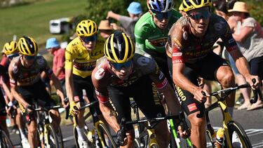 TOPSHOT - (FILES) In this file photo taken on July 16, 2022 Jumbo-Visma team's Slovenian rider Primoz Roglic (L) and Jumbo-Visma team's French rider Christophe Laporte (R) cycle ahead of the pack of riders during the 14th stage of the 109th edition of the Tour de France cycling race, 192,5 km between Saint-Etienne and Mende in central France. - Jumbo-Visma team's Slovenian rider Primoz Roglic pulled out of the 21-day bike race ahead of the 15th stage between Rodez and Carcassonne. Roglic was injured in a fall on the cobbles of the northern French mining roads on stage five, but was fundamental in causing Pogacar's meltdown on the Col du Granon on the second of three Alpine stages. (Photo by Marco BERTORELLO / AFP)