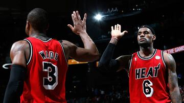 ATLANTA, GA - FEBRUARY 20: LeBron James #6 of the Miami Heat reacts with Dwyane Wade #3 after hitting a three-point basket against the Atlanta Hawks as time expired in the first half at Philips Arena on February 20, 2013 in Atlanta, Georgia. NOTE TO USER: User expressly acknowledges and agrees that, by downloading and or using this photograph, User is consenting to the terms and conditions of the Getty Images License Agreement. (Photo by Kevin C. Cox/Getty Images)