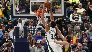 Feb 13, 2019; Indianapolis, IN, USA; Milwaukee Bucks forward Giannis Antetokounmpo (34) dunks against Indiana Pacers forward Bojan Bogdanovic (44) during the first quarter at Bankers Life Fieldhouse. Mandatory Credit: Brian Spurlock-USA TODAY Sports