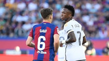 Barcelona's Spanish midfielder #06 Gavi and Real Madrid's Brazilian forward #07 Vinicius Junior react during the Spanish league football match between FC Barcelona and Real Madrid CF at the Estadi Olimpic Lluis Companys in Barcelona on October 28, 2023. (Photo by Josep LAGO / AFP)