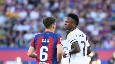 Barcelona's Spanish midfielder #06 Gavi and Real Madrid's Brazilian forward #07 Vinicius Junior react during the Spanish league football match between FC Barcelona and Real Madrid CF at the Estadi Olimpic Lluis Companys in Barcelona on October 28, 2023. (Photo by Josep LAGO / AFP)