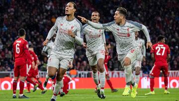 MUNICH, GERMANY - MARCH 13: Virgil Van Dijk of FC Liverpool celebrates with team mates after scoring his team's second goal during the UEFA Champions League Round of 16 Second Leg match between FC Bayern Muenchen and Liverpool at Allianz Arena on Ma