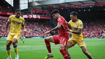 Crystal Palace's French defender #05 Maxence Lacroix (L) and Crystal Palace's Colombian defender #12 Daniel Munoz (R) fight for the ball with Liverpool's Colombian midfielder #07 Luis Diaz during the English Premier League football match between Liverpool and Crystal Palace at Anfield in Liverpool, north west England on May 25, 2025. (Photo by Paul ELLIS / AFP) / RESTRICTED TO EDITORIAL USE. No use with unauthorized audio, video, data, fixture lists, club/league logos or 'live' services. Online in-match use limited to 120 images. An additional 40 images may be used in extra time. No video emulation. Social media in-match use limited to 120 images. An additional 40 images may be used in extra time. No use in betting publications, games or single club/league/player publications. /
