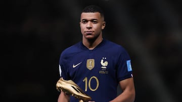 LUSAIL CITY, QATAR - DECEMBER 18: Kylian Mbappe of France reacts with the Golden Boot award after the FIFA World Cup Qatar 2022 Final match between Argentina and France at Lusail Stadium on December 18, 2022 in Lusail City, Qatar. (Photo by Alex Livesey - Danehouse/Getty Images)