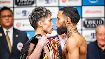 Japan�s Naoya Inoue (L) and Mexico�s Luis Nery stare each other down during the official weigh-in in Tokyo on May 5, 2024 ahead of their super-bantamweight title boxing match. (Photo by Philip FONG / AFP)
