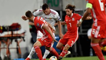 Wales&#039; defender defender James Lawrence (L) and midfielder Joe Allen (R) vie with Hungary&#039;s forward Adam Szalai (C) during the UEFA Euro 2020 qualifier Group E football match Hungary against Wales on June 11, 2019 in Budapest. (Photo by ATTILA K