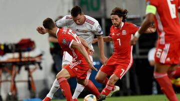 Wales' defender defender James Lawrence (L) and midfielder Joe Allen (R) vie with Hungary's forward Adam Szalai (C) during the UEFA Euro 2020 qualifier Group E football match Hungary against Wales on June 11, 2019 in Budapest. (Photo by ATTILA K