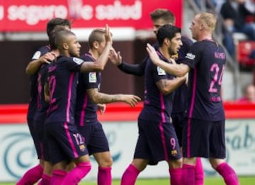 GIJON, SPAIN - SEPTEMBER 24:  Rafinha of FC Barcelona celebrates after scoring his team's second goal during the La Liga match between Real Sporting de Gijon and FC Barcelona at Estadio El Molinon on September 24, 2016 in Gijon, Spain.  (Photo by Juan Man