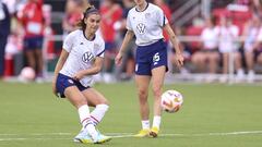 WASHINGTON, DC - SEPTEMBER 06: Alex Morgan #13 (L) and Megan Rapinoe #15 of the United States warm up before playing against Nigeria at Audi Field on September 06, 2022 in Washington, DC.   Tim Nwachukwu/Getty Images/AFP