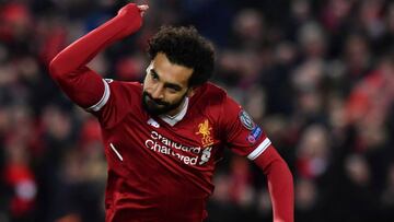 Liverpool's Egyptian midfielder Mohamed Salah celebrates scoring the opening goal during the UEFA Champions League first leg quarter-final football match between Liverpool and Manchester City, at Anfield stadium in Liverpool, north west England on Ap