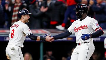 Cleveland (United States), 17/10/2024.- Cleveland Guardians pinch hitter Jhonkensy Noel (R) reacts with Cleveland Guardians outfielder Lane Thomas (L) after hitting a two-run home run against the New York Yankees in the ninth inning of the Major League Baseball (MLB) American League Championship Series playoff game three between the New York Yankees and the Cleveland Guardians in Cleveland, Ohio, 17 October 2024. The winner of the best-of-seven games American League Championship Series will face the winner of the National League Championship Series in the World Series. (Liga de Campeones, Nueva York) EFE/EPA/DAVID MAXWELL