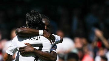 Fulham's Mexican striker #07 Raul Jimenez celebrates with teammate after scoring his team first goal during the English Premier League football match between Fulham and Everton at Craven Cottage in London on May 10, 2025. (Photo by Ben STANSALL / AFP) / RESTRICTED TO EDITORIAL USE. No use with unauthorized audio, video, data, fixture lists, club/league logos or 'live' services. Online in-match use limited to 120 images. An additional 40 images may be used in extra time. No video emulation. Social media in-match use limited to 120 images. An additional 40 images may be used in extra time. No use in betting publications, games or single club/league/player publications. /