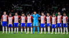 Girona's players observe a minute of silence for recently passed away Spanish journalist and writer Antonio Burgos, before the start of the Spanish league football match between Real Betis and Girona FC at the Benito Villamarin stadium in Seville on December 21, 2023. (Photo by CRISTINA QUICLER / AFP)