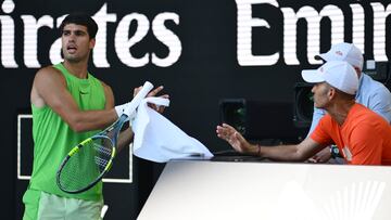 MELBOURNE, AUSTRALIA - JANUARY 30: Carlos Alcaraz of Spain talks with his coach Samuel Lopez in the Men's Singles Semifinal match against Alexander Zverev of Germany during day 13 of the 2026 Australian Open at Melbourne Park on January 30, 2026 in Melbourne, Australia. (Photo by Quinn Rooney/Getty Images)