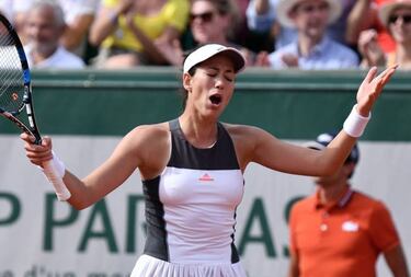 Muguruza down and out in Paris as Mladenovic marches on