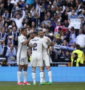 Benzema celebrates with his team mates.