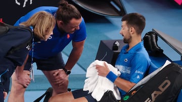 Serbia's Novak Djokovic prepares to leave the court for a medical timeout during his men's singles quarterfinal match against Spain's Carlos Alcaraz on day ten of the Australian Open tennis tournament in Melbourne on January 21, 2025. (Photo by DAVID GRAY / AFP) / -- IMAGE RESTRICTED TO EDITORIAL USE - STRICTLY NO COMMERCIAL USE --