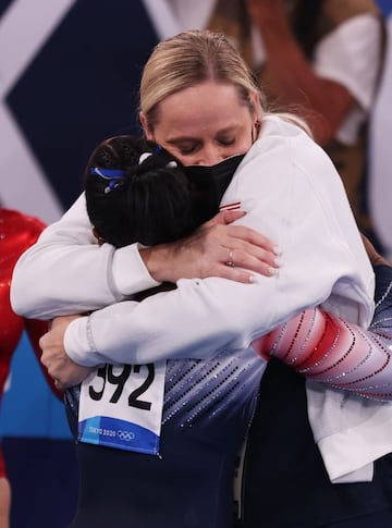 Simone Biles of Team United States and coach Cecile Canqueteau-Landi embrace during the Women's Balance Beam Final on day eleven of the Tokyo 2020