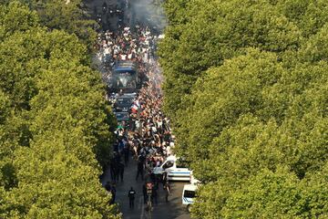 The bus transporting the France's national football team arrives in Paris near the Champs-Elysees avenue, on July 16, 2018 after winning the Russia 2018 World Cup final football match