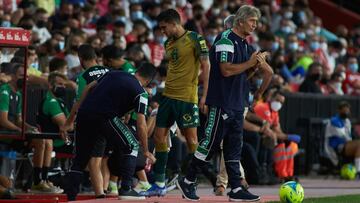 Marc Bartra of Real Betis and Manuel Pellegrini, head coach of Real Betis, during the spanish league, La Liga Santander, football match played between Granada CF and Real Betis at Nuevos los Carmenes stadium on September 13, 2021, in Granada, Spain.
 AFP7