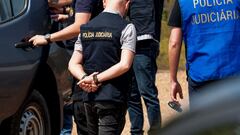 Officers of Portugal's investigative Judicial Police are seen at the site of a remote reservoir where a new search for the body of Madeleine McCann is set to take place, in Silves, Portugal, in this screen grab from a video, May 22, 2023. REUTERS/Luis Ferreira