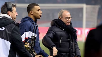 PARIS, FRANCE - MARCH 3: Kylian Mbappe of PSG celebrates its 201st goal for PSG - becoming PSG top scorer in history, surpassing Edison Cavani and his 200 goals - during a trophy ceremony - here with Luis Campos of PSG - following the Ligue 1 match between Paris Saint-Germain (PSG) and FC Nantes at Parc des Princes stadium on March 3, 2023 in Paris, France. (Photo by Jean Catuffe/Getty Images)