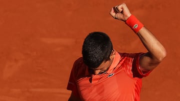 Serbia's Novak Djokovic celebrates a point against Russia's Karen Khachanov during their men's singles quarter final match on day ten of the Roland-Garros Open tennis tournament at the Court Philippe-Chatrier in Paris on June 6, 2023. (Photo by Thomas SAMSON / AFP)