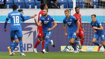 Hoffenheim's Bosnian defender Ermin Bicakcic (3L) celebrates with teammates scoring the opening goal during the German first division Bundesliga football match TSG 1899 Hoffenheim v FC Bayern Munich on September 27, 2020 in Mainz, southern Germany. (