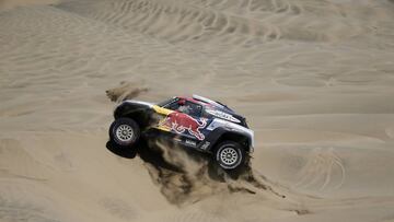 Driver Cyril Despres, of France, and co-driver Jean-Paul Cottret, of France, race their Mini during the stage seven of the Dakar Rally in San Juan de Marcona, Peru, Monday, Jan. 14, 2019. (AP Photo/Ricardo Mazalan)