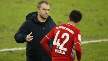 Soccer Football -  Bundesliga - Schalke 04 v Bayern Munich - Veltins-Arena, Gelsenkirchen, Germany - January 24, 2021 Bayern Munich coach Hansi Flick with  Jamal Musiala Pool via REUTERS/Leon Kuegeler DFL regulations prohibit any use of photographs as ima