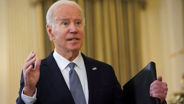 U.S. President Joe Biden speaks with reporters after delivering remarks on the November jobs report at the White House in Washington, U.S., December 3, 2021. REUTERS/Kevin Lamarque